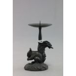 A bronze pricket candlestick in the form of a squirrel