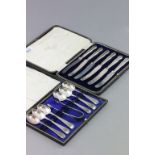 Set of six hallmarked silver handled tea knives; together with a cased set of six silver plated