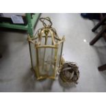 A gilt brass hanging hall lantern