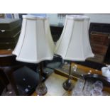 A pair of gilt wood table lamps with shades