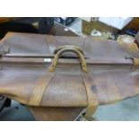 An early 20th century leather cricket bag initialled P.G.S. for Portsmouth Grammar school and