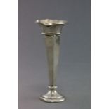 A hallmarked silver tapering bud vase; of hexagonal form; with outswept rim and loaded circular