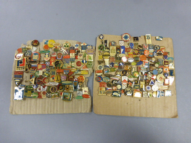 A large collection of various enamel and gilt metal pin badges