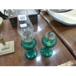 Pair green glass oil lamps