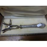 A silver plated joint holder; in fitted box