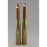 A pair British military issue 40mm brass shells; each with turned wooden tops