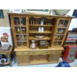 Pine Dresser with Open Shelves flanked by Two Glazed Shelves above Three Drawers, Two Cupboards