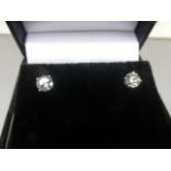 Pair of 14ct white gold diamond stud earrings of 1.1ct's