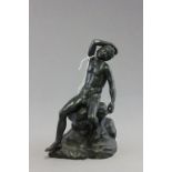 Bronze nude male figure seated on rock