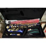 Cased Roy Benson saxophone with accessories