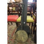 Victorian five string Banjo with one string missing in case