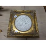 Gilt framed ceramic plaque with cherubs, with medallion to rear dated 1849