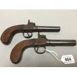 Pair of 19th Century percussion pistols with wooden stocks