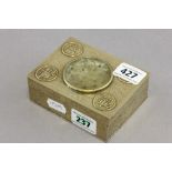 A Chinese brass cigarette box with hard stone roundel