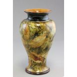 A Doulton stoneware baluster vase; decorated with Autumn leaves; bearing impressed marks to base