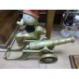 A large Victorian brass cannon, and a brass dog