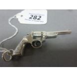 An unusual silver gun with revolving chamber