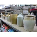 Collection of Ten Stoneware Flagons, Crocks, Barrels and Jars including Flagons stamped Badminton,