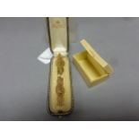 Two hall marked broaches in a leather cased stick pin box plus a small plastic box marked Goya