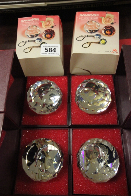 Boxed Swarovski set of four sport paperweights to include Tennis, Golf, Bowls and Badminton