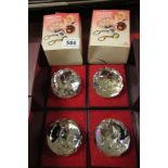 Boxed Swarovski set of four sport paperweights to include Tennis, Golf, Bowls and Badminton