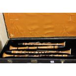 Four 19th century Boxwood Clarinets, including one stamped ' Martin Fes A Paris ' with Ivory Mounts,