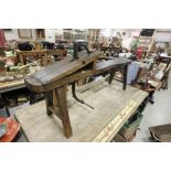 An antique oak wood carvers bench