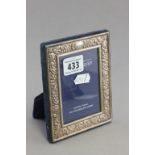 A hallmarked sterling silver photograph frame