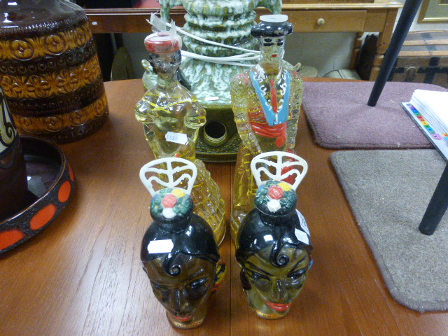 Four Retro Glass Spanish Brandy Decanters in the form of Flamenco Dancers and Bull Fighter