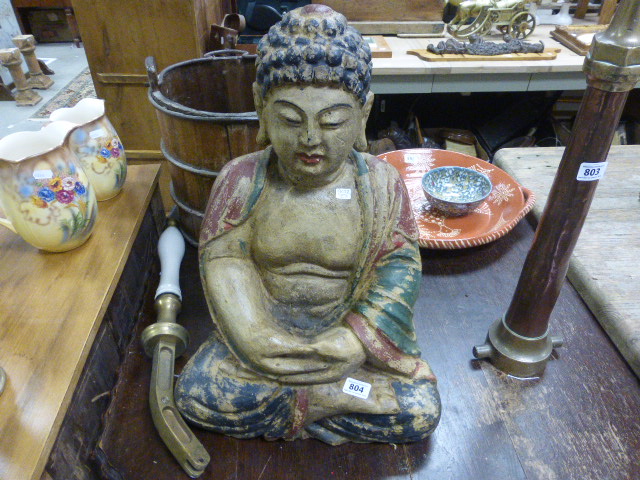 A large Eastern carved wood deity