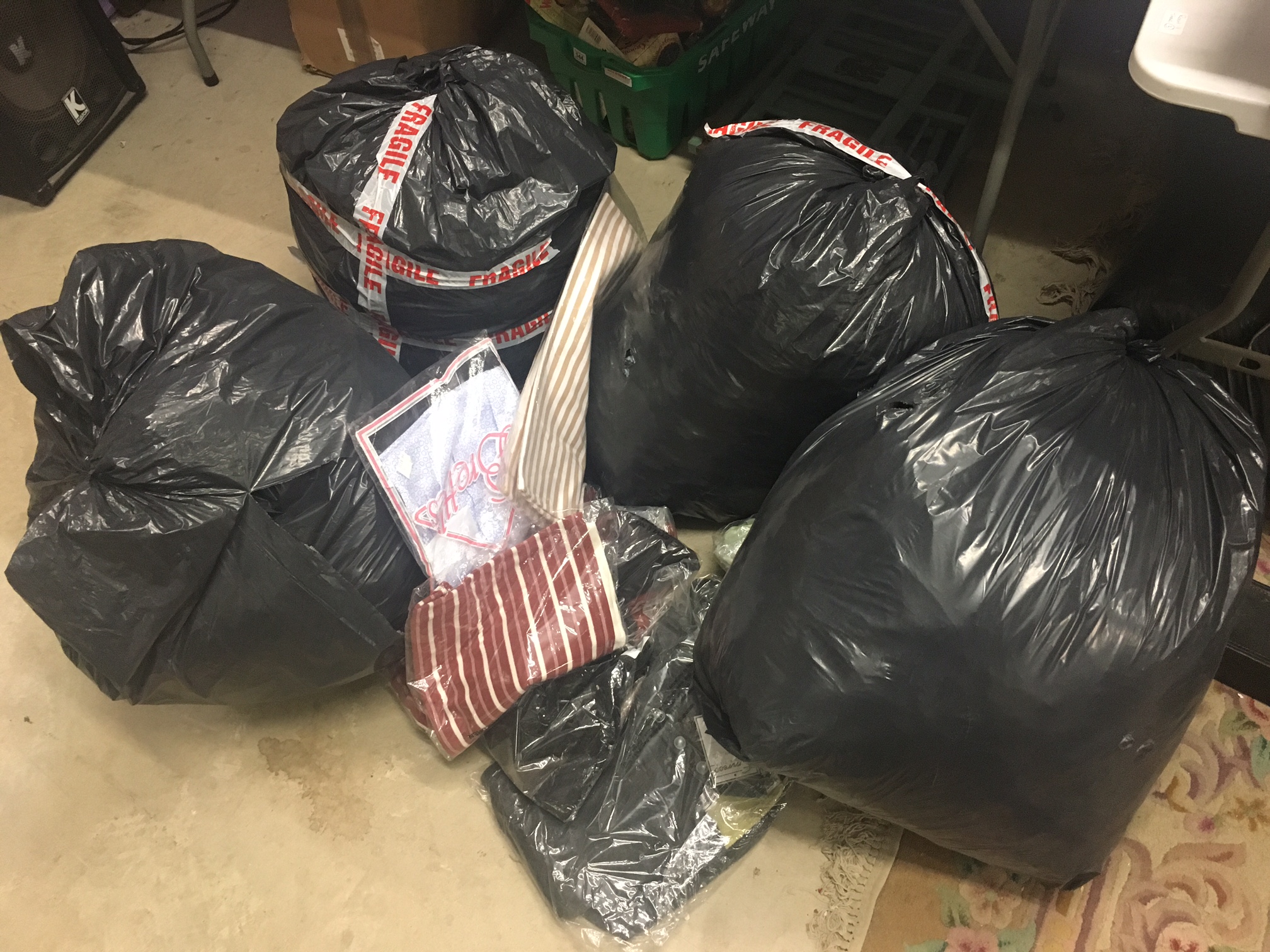 Large quantity of vintage clothing from a clothing shop closure