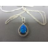 A silver, CZ & blue opal drop pendant necklace on a silver chain