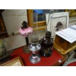 Two Victorian Oil Lamps, Chrome Oil Lamp, another Lamp and Two Chimneys