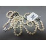 A long freshwater pearl necklace with Chanel style spacers