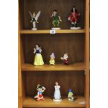 Nine Ceramic Disney Figures from Peter Pan, Snow White and Pinocchio