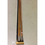 Two malacca walking sticks with white metal knopps plus another