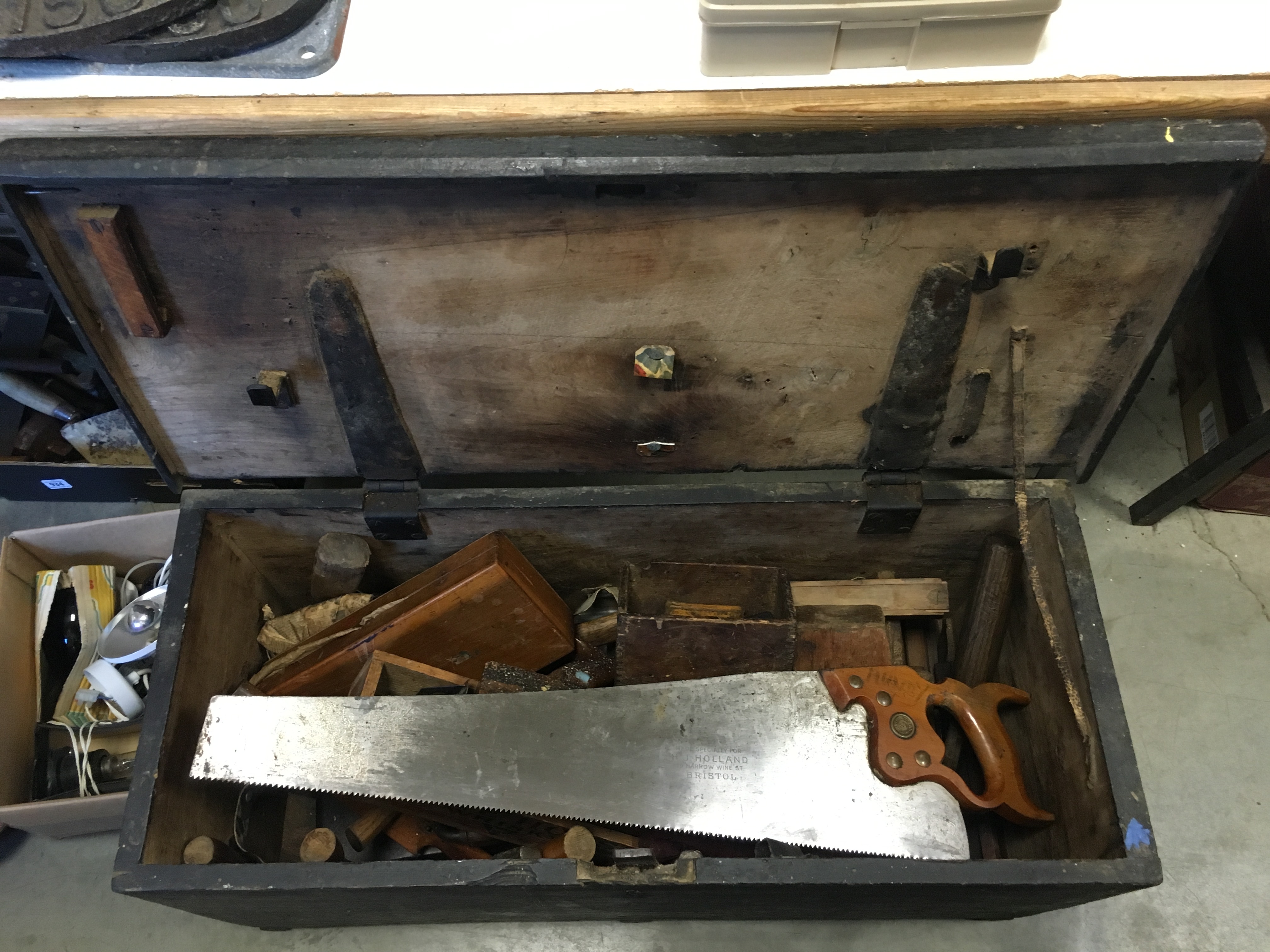 Wooden trunk containing a quantity of various vintage tools