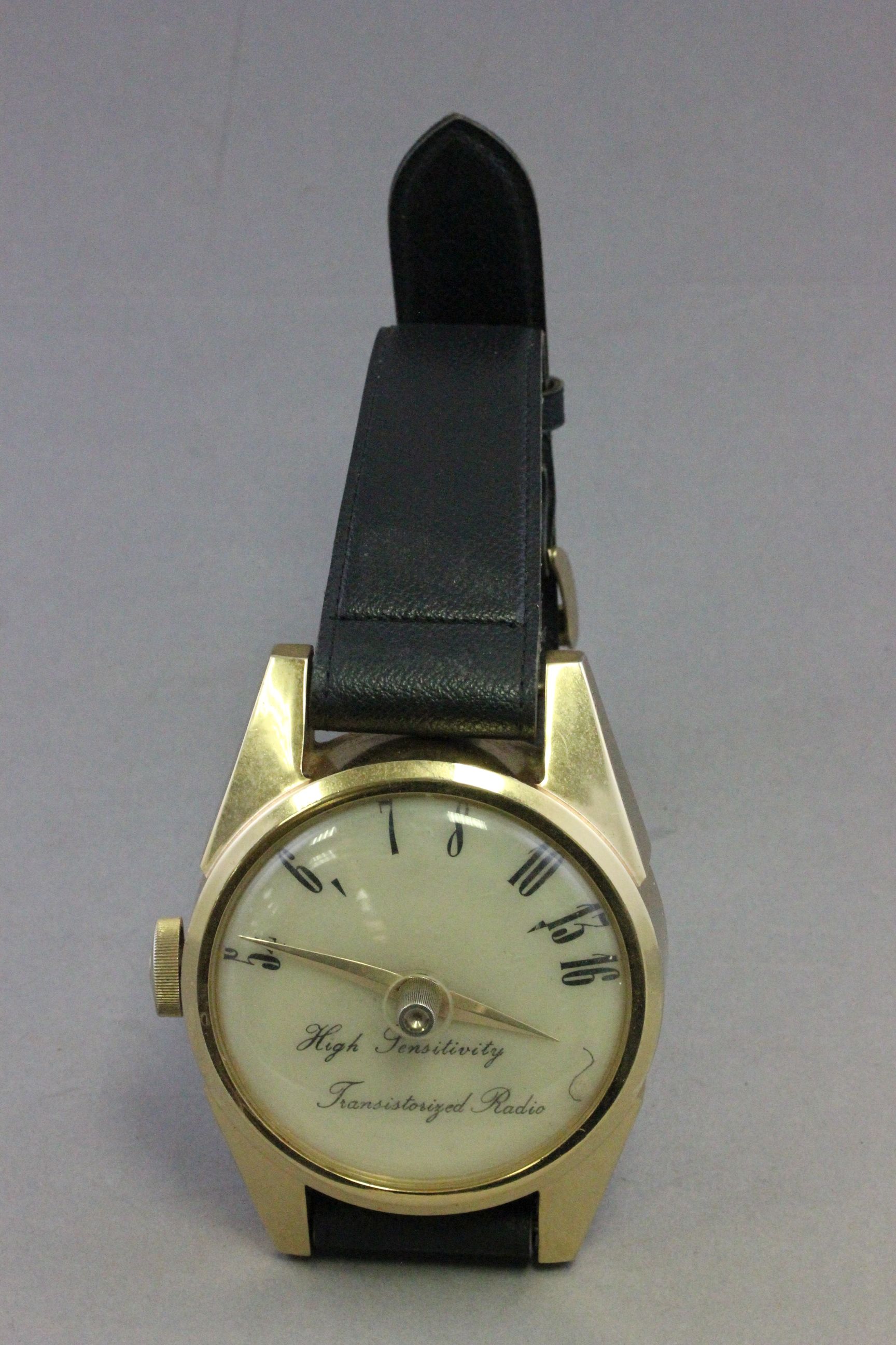 Novelty shop display radio in the form of a wristwatch