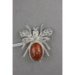 Silver and amber bug brooch