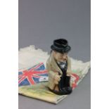 Doulton character jug of Winston Churchill and an early 20th C silk souvenir of Egypt decorated with