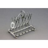 Early 20th C silver plated toast rack in the form of golf clubs