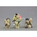 Three netsuke style figures including fisherman x 2 and girl with umbrella