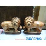 A pair of decorative ceramic lions