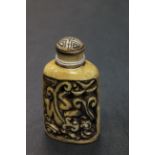 Bone snuff bottle with crawling dragon to sides