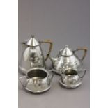 A four piece Liberty & Co Tudric four piece coffee and tea set, model number 0303