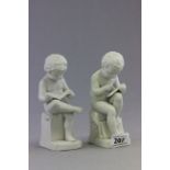 A pair of ceramic cherubs