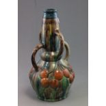 A large Belgian art pottery vase with streaked and fruit decoration