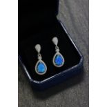 Pair of silver CZ and blue opal drop earrings