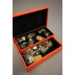 Orange jewellery box containing costume jewellery