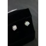 Pair of silver and opal ear studs